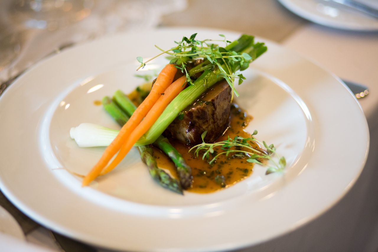 Crafting Captivating Headlines: Your awesome post title goes here Luxurious gourmet meal elegantly plated with vegetables and sauce.