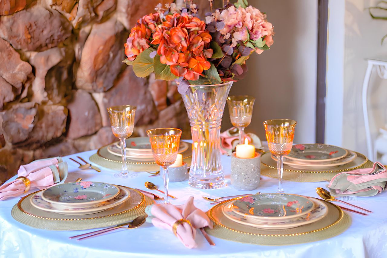 Beautifully arranged dining table with floral centerpiece, perfect for special occasions.